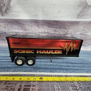 Vintage Buddy L pressed steel/plastic sonic hauler trailer black/red/gold